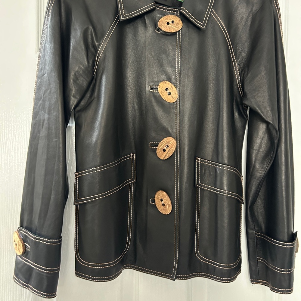 Stylish Black Leather Jacket with Unique Buttons